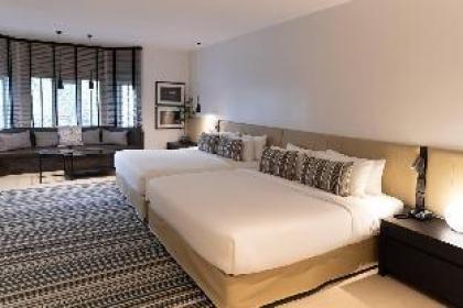 A cozy living with two king size beds - image 3