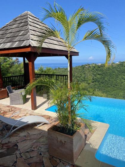 Bungalow d'une chambre avec vue sur la mer piscine partagee et terrasse a Marigot Vieux Habitants a 6 km de la plage