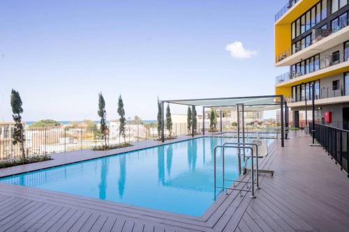 Luxury Beach Apartment with Pool & Gym By Airsuite - main image