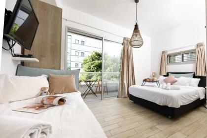 Stylish 3BR Apt w Balcony 5 min Walk from Beach by Sea N' Rent - image 17