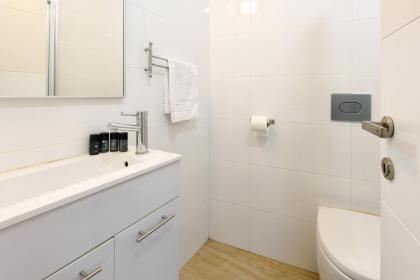 Stylish 3BR Apt w Balcony 5 min Walk from Beach by Sea N' Rent - image 19