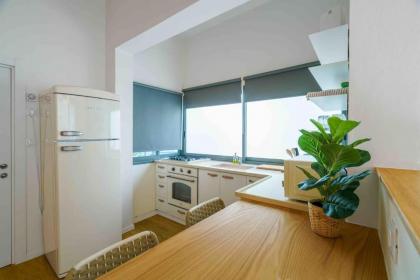 A designed loft by the sea with a balcony - image 10
