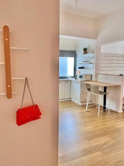 A designed loft by the sea with a balcony - image 19