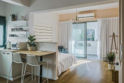 A designed loft by the sea with a balcony - image 8