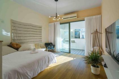 A designed loft by the sea with a balcony - image 9