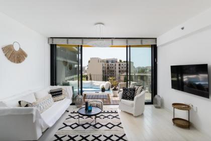 Bright & Chic Condo with Pool & Unique View by FeelHome