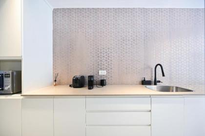 Stylish 3BR Garden Apartment Steps from the Beach - image 11