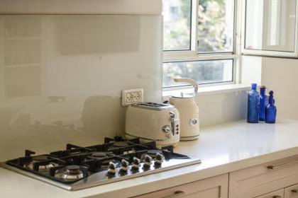 Chic 2BR Apt w Large Windows in Tel Aviv Old North Sea N' Rent - image 9